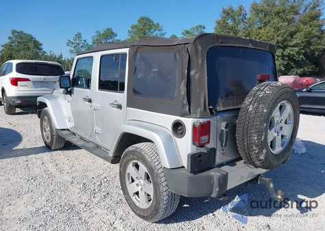 2011 Jeep Wrangler Unlimited Sahara from USA, damaged, VIN 1J4BA5H18BL522774